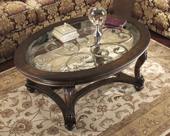 Norcastle - Dark Brown - Oval Cocktail Table Cleveland Home Outlet (OH) - Furniture Store in Middleburg Heights Serving Cleveland, Strongsville, and Online