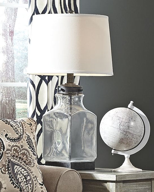 Sharolyn - Transparent / Silver Finish - Glass Table Lamp Cleveland Home Outlet (OH) - Furniture Store in Middleburg Heights Serving Cleveland, Strongsville, and Online