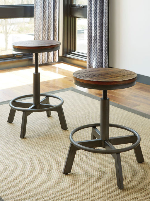 Torjin - Dark Brown - 3 Pc. - Long Counter Table, 2 Stools Cleveland Home Outlet (OH) - Furniture Store in Middleburg Heights Serving Cleveland, Strongsville, and Online