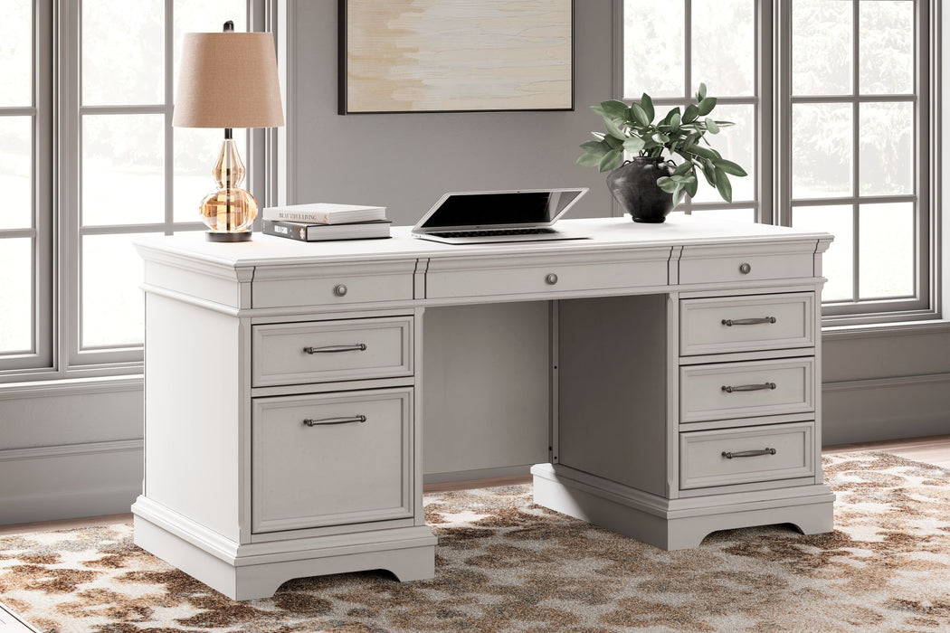 Kanwyn - Whitewash - Home Office Desk With Eight Drawers Cleveland Home Outlet (OH) - Furniture Store in Middleburg Heights Serving Cleveland, Strongsville, and Online