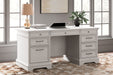 Kanwyn - Whitewash - Home Office Desk With Eight Drawers Cleveland Home Outlet (OH) - Furniture Store in Middleburg Heights Serving Cleveland, Strongsville, and Online