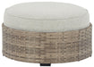 Calworth - Beige - Ottoman With Cushion Cleveland Home Outlet (OH) - Furniture Store in Middleburg Heights Serving Cleveland, Strongsville, and Online